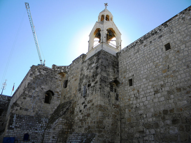 Exterior stone walls and bell tower of the Church of the Nativity in Bethlehem