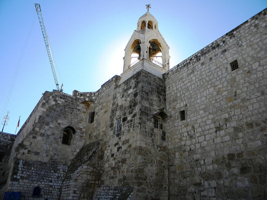 Exterior stone walls and bell tower of the Church of the Nativity in Bethlehem