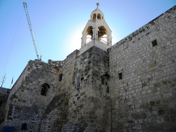 Exterior stone walls and bell tower of the Church of the Nativity in Bethlehem